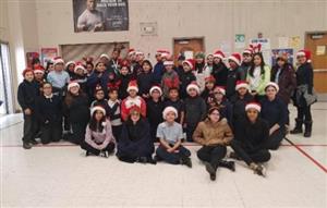 students wearing their holiday head wear in the gym 